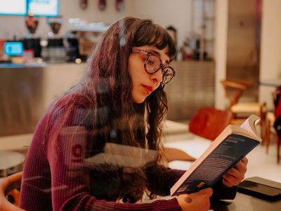 Coffee and a book representing a relaxed lifestyle break
