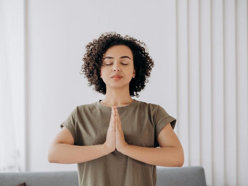 Person practicing eye exercises in a bright minimalist office